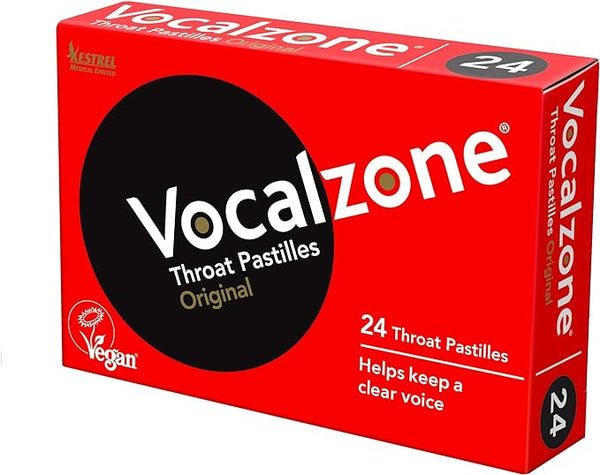 A red box of Vocalzone Sore Throat Pastilles contains 24 vegan-friendly pastilles labeled as Original, ideal for voice professionals. It highlights benefits like maintaining a clear voice and offering sore throat relief with its effective vocal care formula.