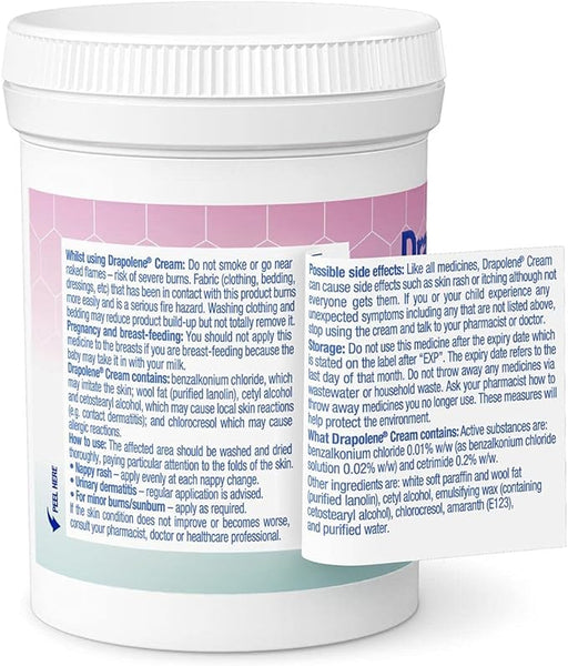 A white container labeled Drapolene Antiseptic Cream (200g) features usage instructions, side effects, and ingredients. A leaflet beside it offers more details. Produced by Drapolene, its ideal for treating nappy rash and urinary dermatitis.