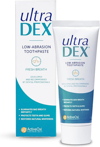 Image of UltraDex Low Abrasion Toothpaste With Fluoride (75ml) and box. The packaging highlights features like low abrasion, 12-hour fresh breath, while emphasizing benefits such as eliminating bad breath, protecting teeth and gums, and restoring natural whiteness.