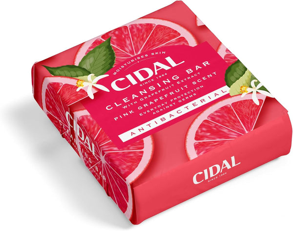 A pink box of Cidal Pink Grapefruit Cleansing Bar Antibacterial With Grapefruit Extract (2 x 100g bars), featuring pink grapefruit, green leaves, and white flowers. The packaging highlights antibacterial care and a fresh grapefruit scent for sensitive skin.