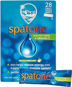 The packaging for Spatone Apple Daily Iron Shots + Vitamin C (28 Sachets) features a striking droplet design, emphasizing the supplements benefits of energy release and immune support. It offers a tasty apple flavor with sachets ideal for pairing with Vitamin C.