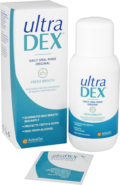 The image shows Ultradex Daily Oral Rinse With Fluoride (250ml) beside its packaging, highlighting benefits like eliminating bad breath, protecting teeth and gums, and being alcohol-free. A leaflet explains its advanced formula for comprehensive oral care.