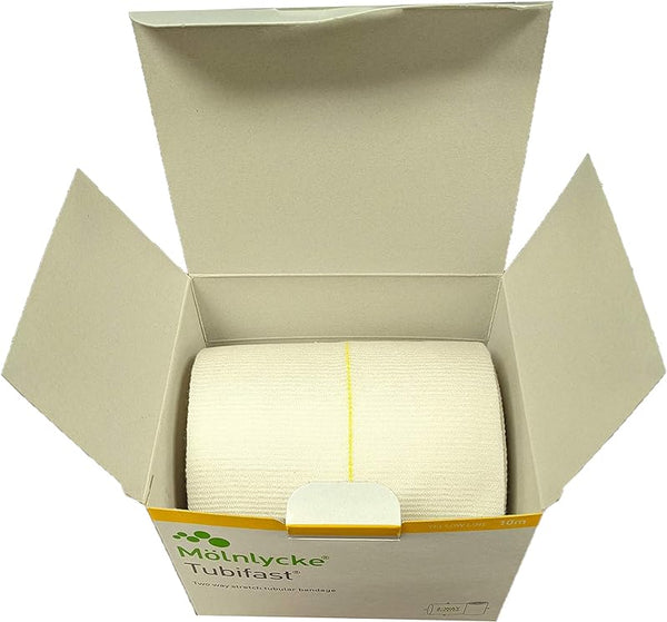 The open box contains a Tubifast Bandage Yellow 5M, a lightweight elasticated tubular bandage. It features yellow and white packaging with product details and a distinctive yellow line for dressing retention.