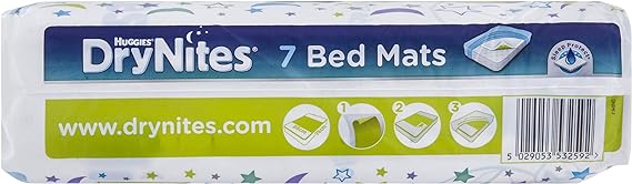 Huggies DryNites Bed 7 Mats, designed for overnight protection, showcase a blue and green design. The packaging highlights 7 Bed Mats with a step-by-step guide in a green box. A website URL and barcode are prominently displayed for convenience.