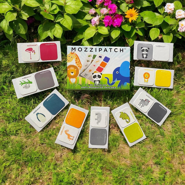 A box of Mozzipatch Anti-Mosquito Stick on Patches for Kids (20 patches) by Mozzipatch is shown outdoors, surrounded by ten colorful animal-themed afterbite patch packets on grass with flowers and lush greenery in the background.