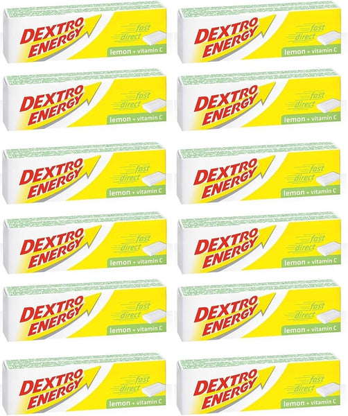 Twenty-four packs of Dextro Energy Tablets-Lemon are neatly arrayed in a grid. Each pack, adorned with a yellow lightning design and the DEXTRO ENERGY label, offers a quick boost with dextrose and vitamin C.