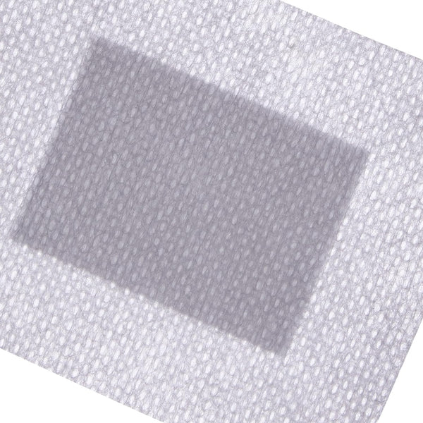 Close-up of Softpore Dressing, a rectangular, textured adhesive bandage (6x7cm) in gray. Made from hypoallergenic material with a central gauze pad and perforated edges, its ideal for wound care and small cuts. Comes in a pack of 60.