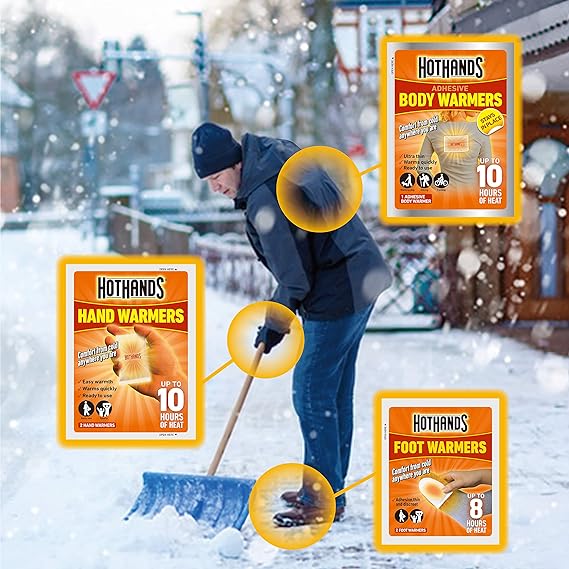 Amid chilly weather, someone shovels snow with Hot Hands (Pack of 2) from Hot Hands. The hand, body, and foot warmers provide up to 10 hours of heat against snow-laden streets and houses in this essential outdoor activity.