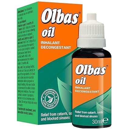 A 75ml bottle of Olbas Oil Inhalant with a dropper cap accompanies its green and orange packaging, labeled Inhalant Decongestant for relief from catarrh, colds, and blocked sinuses. The packaging highlights the use of natural plant oils in this effective decongestant.