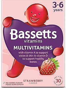 Box of Bassetts Soft & Chewy Multivitamins for ages 3-6 in strawberry flavor with 30 pieces. The packaging features a smiling red character with a purple heart, emphasizing vitamin A for vision and skin, and vitamin D for bones.