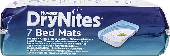 The Huggies DryNites Bed 7 Mats package promises overnight protection with its 7 mats, featuring multilingual product info and a bed mat image on the blue packaging. Stars and crescents at the top assure peaceful nights.