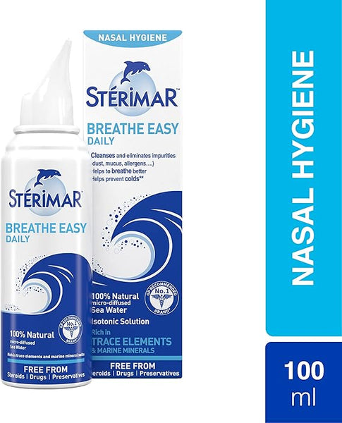 Image of a Sterimar nasal spray product. The spray canister and box feature blue branding with waves and dolphins. Text highlights Breathe Easy Daily, 100% Natural Sea Water, and Free From Steroids/Drugs. This isotonic solution provides effective allergy relief. Volume is 50 ml.