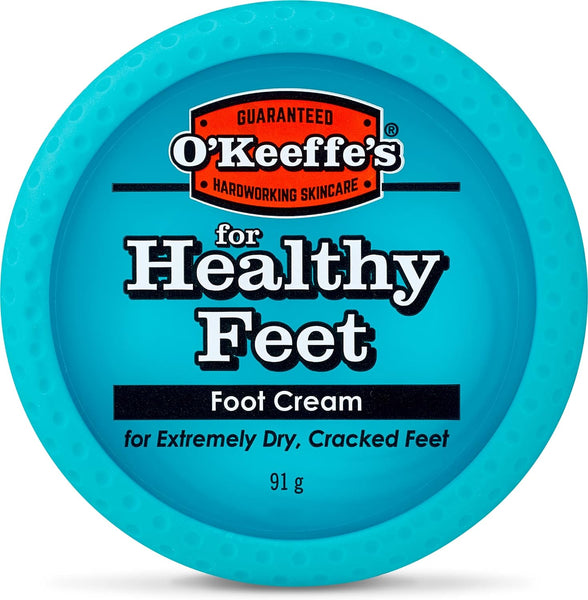 OKeeffes Healthy Feet Foot Cream (91g) comes in a blue circular container ideal for extremely dry and cracked skin. The lid showcases the OKeeffes brand logo with a hardworking skincare promise, holding 91 grams of rejuvenating cream.