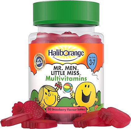 A jar of Seven Seas Haliborange Mr Men Multi-Vitamin Softies for kids aged 3-7 contains strawberry-flavored vitamins. The jar has a green lid, features cartoon characters, includes essential nutrients, and holds 30 softies with some scattered in front.