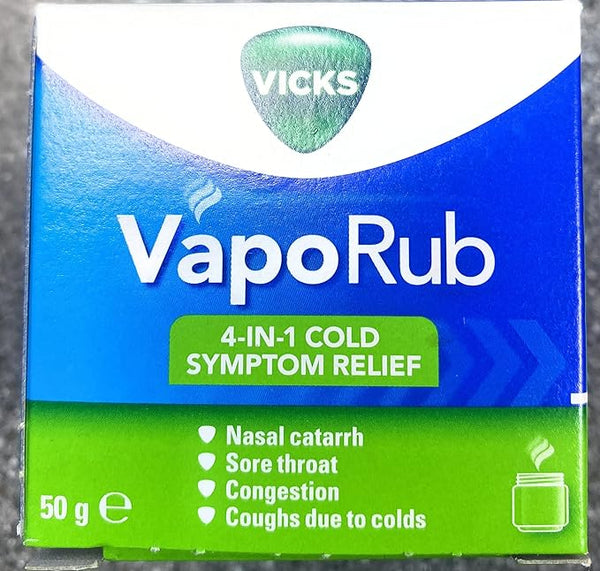 The image features a box of Vicks Vaporub Ointment (50g) showcasing 4-in-1 Cold Symptom Relief, including sore throat relief. Its blue and green packaging emphasizes benefits for nasal catarrh, congestion, and coughs from colds.