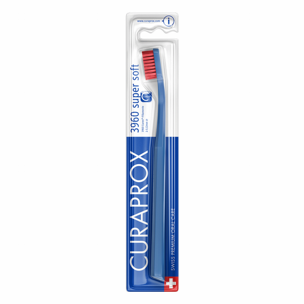 The Curaprox Supersoft Toothbrush CS3960, featuring gentle Curen®-filaments for effective plaque removal, comes in a blue and red design. The packaging highlights Swiss quality with blue text and a Swiss flag at the bottom right corner.