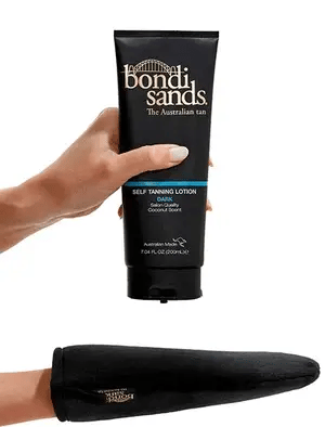 A hand holds Bondi Sands Self Tanning Lotion Dark (200ml), ideal for a sun-kissed glow. Below is a black Bondi Sands tanning mitt, perfect for applying the lotion and achieving a natural-looking tan.