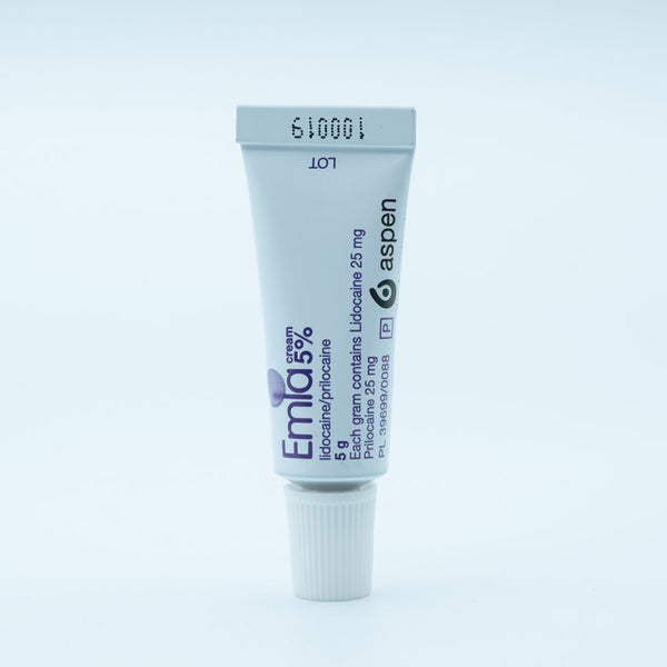 A white tube of Emla Numbing Cream 5% (5g) by Aspen Pharmacare stands upright against a light background, labeled for numbing and pain relief with lidocaine and prilocaine, with its lot number printed at the top.