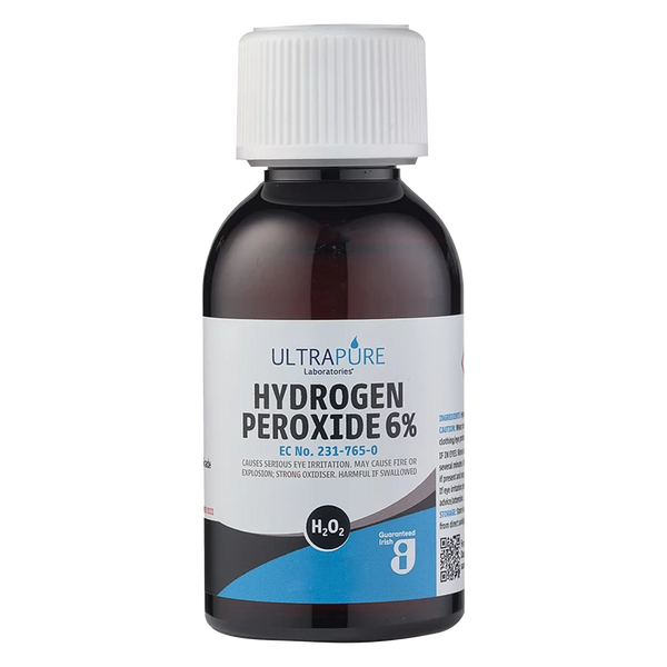 A bottle of Care Hydrogen Peroxide 6% (20 Vols) with a white cap, suitable for hair bleaching and disinfection.