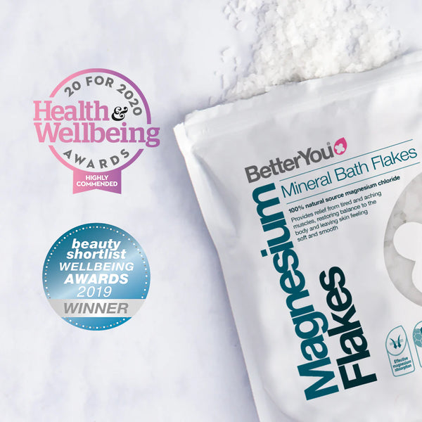 An image shows BetterYou Magnesium Flakes packaging with bath flakes spilling out, highlighting its recognition with awards: Health & Wellbeing Awards 2020 (Highly Commended) and Beauty Shortlist Wellbeing Awards 2019 (Winner), making it the ultimate body soak experience.