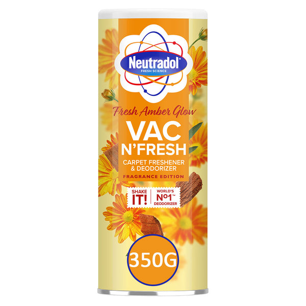 Neutradol Vac Scents Fresh Amber Glow Carpet Deodorizer (350g) by Neutradol comes in a cylindrical container, featuring orange and yellow flowers, a cinnamon stick, and is designed to freshen and neutralize carpet odours.