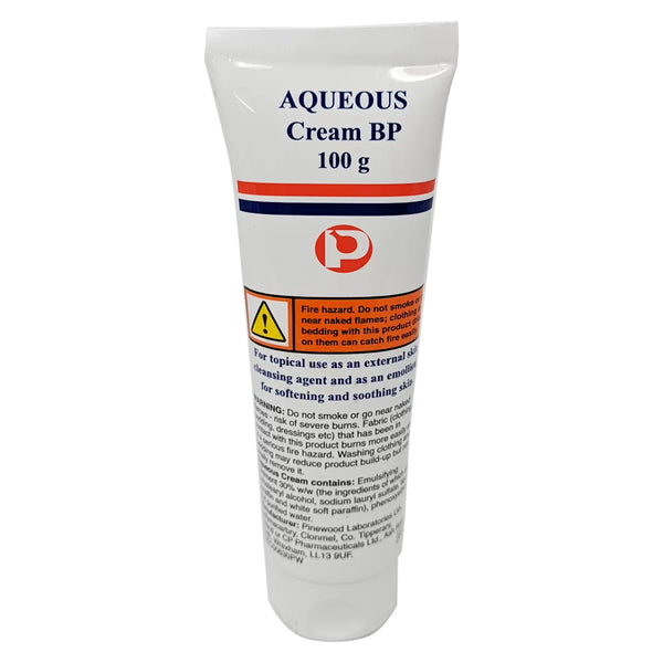 A white tube of Aqueous Aqueous Cream BP (100g) features red and blue stripes and highlights its use for dry skin and eczema. It includes a fire hazard warning and is marked for topical use, effectively softening and soothing the skin.