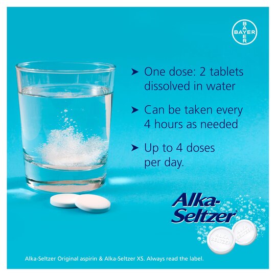 A glass of bubbling water with effervescent Alka-Seltzer XS Double Action tablets. Text reads: Take 2 tablets dissolved in water every 4 hours as needed, up to 4 times daily for pain relief. The Alka-Seltzer logo is prominently displayed.