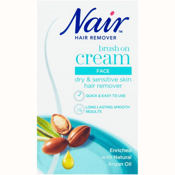 Front of a Nair Hair Remover Brush On Cream for Face (50ml) box, showing text about gentle hair removal for dry and sensitive skin, enriched with natural argan oil, plus a close-up image of argan nuts and oil. Brand: Nair.