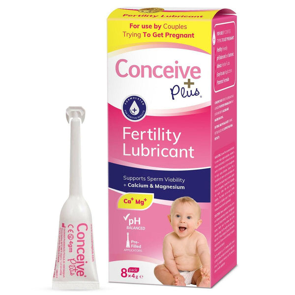 A pink and white box of Conceive Plus Fertility Lubricant Pre-Filled Applicators (8x4g) features an image of a smiling baby and emphasizes support for sperm viability with calcium and magnesium, underscoring the promise of new life.