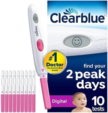 The Clearblue Ovulation Digital Test (10 Tests) packaging includes a digital display showing a smiley face for LH surge detection. It states #1 Doctor recommended brand, helps find your 2 peak days, and features an image of a baby on the bottom.